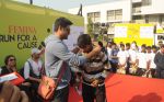 Manav Gohil felicitating the winner of _Femina Marathon-Run to Save The Girl Child_.1